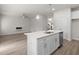 Kitchen island with stainless steel appliances and view into living room at 2955 Jefferson St, Austell, GA 30106