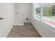 Convenient laundry room featuring a washing machine hookup and natural light from the window at 2955 Jefferson St, Austell, GA 30106