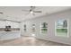 Open-concept living space with kitchen, white cabinets, and stainless steel appliances at 2955 Jefferson St, Austell, GA 30106
