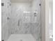 Modern bathroom with glass shower featuring elegant marble-style tiling and sleek fixtures at 2955 Jefferson St, Austell, GA 30106