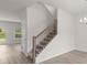 Bright interior shot featuring a staircase with wood railing and neutral-toned carpet at 2955 Jefferson St, Austell, GA 30106