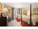 Traditional bedroom featuring two four-poster beds and neutral decor at 45 Paces West Nw Dr, Atlanta, GA 30327