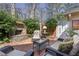 Charming patio with an outdoor fireplace and comfortable seating area at 45 Paces West Nw Dr, Atlanta, GA 30327