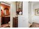 Elegant powder room with ornate wallpaper, classic vanity, and stylish fixtures at 45 Paces West Nw Dr, Atlanta, GA 30327