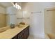 Bathroom with a granite countertop, a large mirror, and neutral walls that create a spa-like space at 6 Nw Fairway Nw Dr, Kennesaw, GA 30144