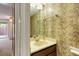 Cozy half-bathroom featuring a vanity and mirror, adding convenience and charm to the living space at 6 Nw Fairway Nw Dr, Kennesaw, GA 30144