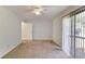 Large bedroom with natural light, neutral carpet, and sliding glass door offers a comfortable and inviting space at 6 Nw Fairway Nw Dr, Kennesaw, GA 30144