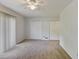 Spacious bedroom with neutral carpet, ceiling fan, and plenty of natural light from sliding glass door at 6 Nw Fairway Nw Dr, Kennesaw, GA 30144