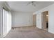 Bright bedroom features neutral carpet, white walls, natural light and a door that leads to a bathroom at 6 Nw Fairway Nw Dr, Kennesaw, GA 30144