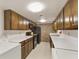 Efficient kitchen featuring tile flooring, white countertops and wooden cabinets at 6 Nw Fairway Nw Dr, Kennesaw, GA 30144