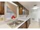 Kitchen with white countertops and cabinets and a double stainless steel sink creates a efficient space at 6 Nw Fairway Nw Dr, Kennesaw, GA 30144
