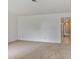 Bright living room featuring neutral carpet and fresh white walls creating a welcoming space at 6 Nw Fairway Nw Dr, Kennesaw, GA 30144