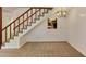 Cozy living area with carpeted stairs, view to kitchen and a classic chandelier that add warmth to the room at 6 Nw Fairway Nw Dr, Kennesaw, GA 30144