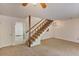 Open-concept living room with staircase and view of entryway, creating a welcoming and spacious atmosphere at 6 Nw Fairway Nw Dr, Kennesaw, GA 30144