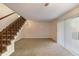 Inviting living room featuring staircase and sliding glass doors providing ample natural light and easy access at 6 Nw Fairway Nw Dr, Kennesaw, GA 30144
