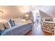 Charming attic space with two beds and a seating area; ideal for a guest room or home office at 1069 Colquitt Ne Ave, Atlanta, GA 30307