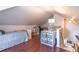Cozy attic bedroom features hardwood floors, storage, and an inviting atmosphere, perfect for relaxation and rest at 1069 Colquitt Ne Ave, Atlanta, GA 30307