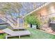 Inviting backyard features lounge chairs, manicured lawn, storage shed, and a covered patio area at 1069 Colquitt Ne Ave, Atlanta, GA 30307