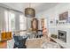 Formal dining area boasts a fireplace and a round glass table, perfect for entertaining at 1069 Colquitt Ne Ave, Atlanta, GA 30307