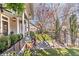 Inviting porch with lush greenery, ceiling fan, swing and stylish decor, perfect for enjoying outdoor living at 1069 Colquitt Ne Ave, Atlanta, GA 30307