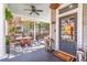 Charming covered front porch with stylish furniture, lighting, and a welcoming entryway into the home at 1069 Colquitt Ne Ave, Atlanta, GA 30307