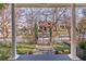 Charming front yard with a well-maintained lawn, a decorative fence, and manicured landscaping at 1069 Colquitt Ne Ave, Atlanta, GA 30307
