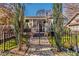 Charming front yard features a beautiful gated entrance, lush landscaping, and walkway to the home at 1069 Colquitt Ne Ave, Atlanta, GA 30307