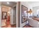 Hallway view of open floorplan with hardwood floors, neutral walls, and stylish artwork at 1069 Colquitt Ne Ave, Atlanta, GA 30307