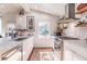 Bright kitchen with white cabinets, marble countertops, and stainless steel appliances at 1069 Colquitt Ne Ave, Atlanta, GA 30307