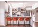 Stylish kitchen island features a marble countertop and seating for four, complemented by modern lighting at 1069 Colquitt Ne Ave, Atlanta, GA 30307
