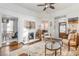 Bright living room with hardwood floors, fireplace, and seamless flow into the dining area at 1069 Colquitt Ne Ave, Atlanta, GA 30307