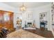 Stylish living room featuring hardwood floors, a fireplace, and a view into the adjacent dining and seating areas at 1069 Colquitt Ne Ave, Atlanta, GA 30307