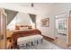 Cozy bedroom with hardwood floors, contemporary furnishings, and en-suite bathroom at 1069 Colquitt Ne Ave, Atlanta, GA 30307