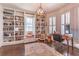 Well-lit office space featuring custom built-in shelves, hardwood floors, and large windows for a productive work environment at 1069 Colquitt Ne Ave, Atlanta, GA 30307