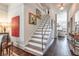 Inviting stairway featuring hardwood steps, contemporary design, and stylish accents at 1069 Colquitt Ne Ave, Atlanta, GA 30307