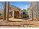 Exterior of home featuring a deck, screened porch, and spacious backyard at 345 Crown Vetch Ln, Alpharetta, GA 30005