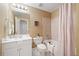 Cozy bathroom with a shower-tub combo, single sink vanity, and neutral color scheme at 345 Crown Vetch Ln, Alpharetta, GA 30005