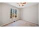 Neutral bedroom with plush carpet and natural light at 345 Crown Vetch Ln, Alpharetta, GA 30005