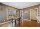Sun-filled breakfast nook with hardwood floors and backyard view at 345 Crown Vetch Ln, Alpharetta, GA 30005