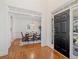 Elegant entryway featuring hardwood floors, a view of the dining room, and a stylish front door at 345 Crown Vetch Ln, Alpharetta, GA 30005