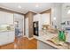 Bright kitchen boasts stainless appliances, granite counters, and hardwood floors at 345 Crown Vetch Ln, Alpharetta, GA 30005