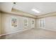 Spacious living area with neutral walls, carpet, and backyard access at 345 Crown Vetch Ln, Alpharetta, GA 30005