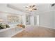Spacious main bedroom with neutral tones, a ceiling fan, and lots of natural light at 345 Crown Vetch Ln, Alpharetta, GA 30005