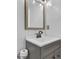 Stylish bathroom featuring a gray vanity with a modern faucet and elegant mirror at 4663 Hairston Crossing Pl, Stone Mountain, GA 30083