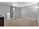 Bright bedroom with gray walls, tan carpet, window with blinds, standing mirror and lamp at 4663 Hairston Crossing Pl, Stone Mountain, GA 30083