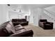 Bright living room offering ample seating with comfortable sofas and a cozy armchair, ideal for entertaining guests at 4663 Hairston Crossing Pl, Stone Mountain, GA 30083