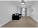 Bright living room with neutral carpet, a window with curtains, and ceiling fan at 4663 Hairston Crossing Pl, Stone Mountain, GA 30083