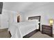 Inviting bedroom featuring a cozy bed, nightstand, and a closet; perfect for relaxation at 4663 Hairston Crossing Pl, Stone Mountain, GA 30083