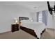 Serene bedroom features soft carpet, a bed, nightstand with a lamp, and a window at 4663 Hairston Crossing Pl, Stone Mountain, GA 30083