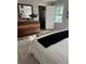 Bedroom featuring a dresser with a large mirror, decorative accessories, and entrance to bathroom at 112 Village Ct, Woodstock, GA 30188
